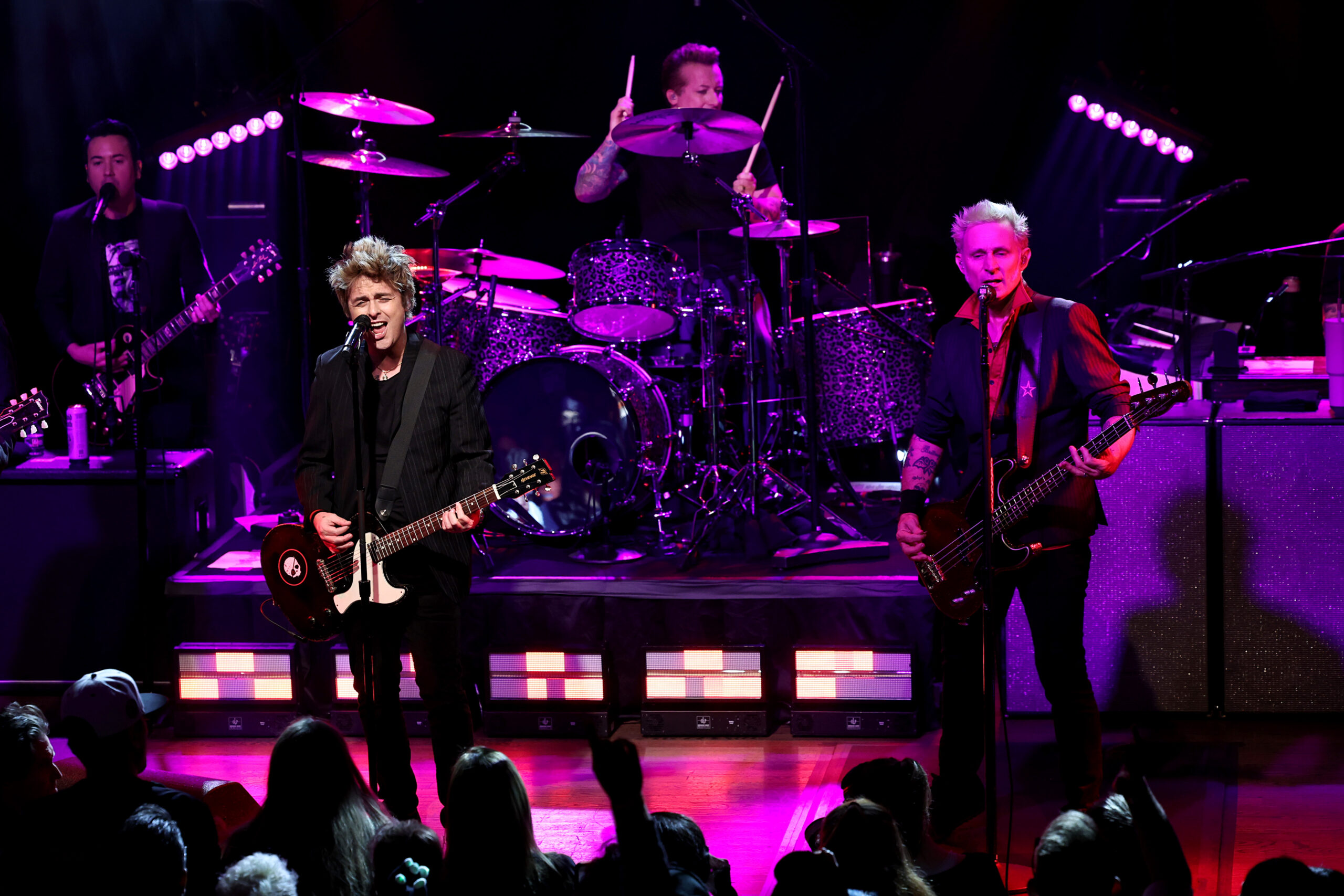 Green Day playing on stage